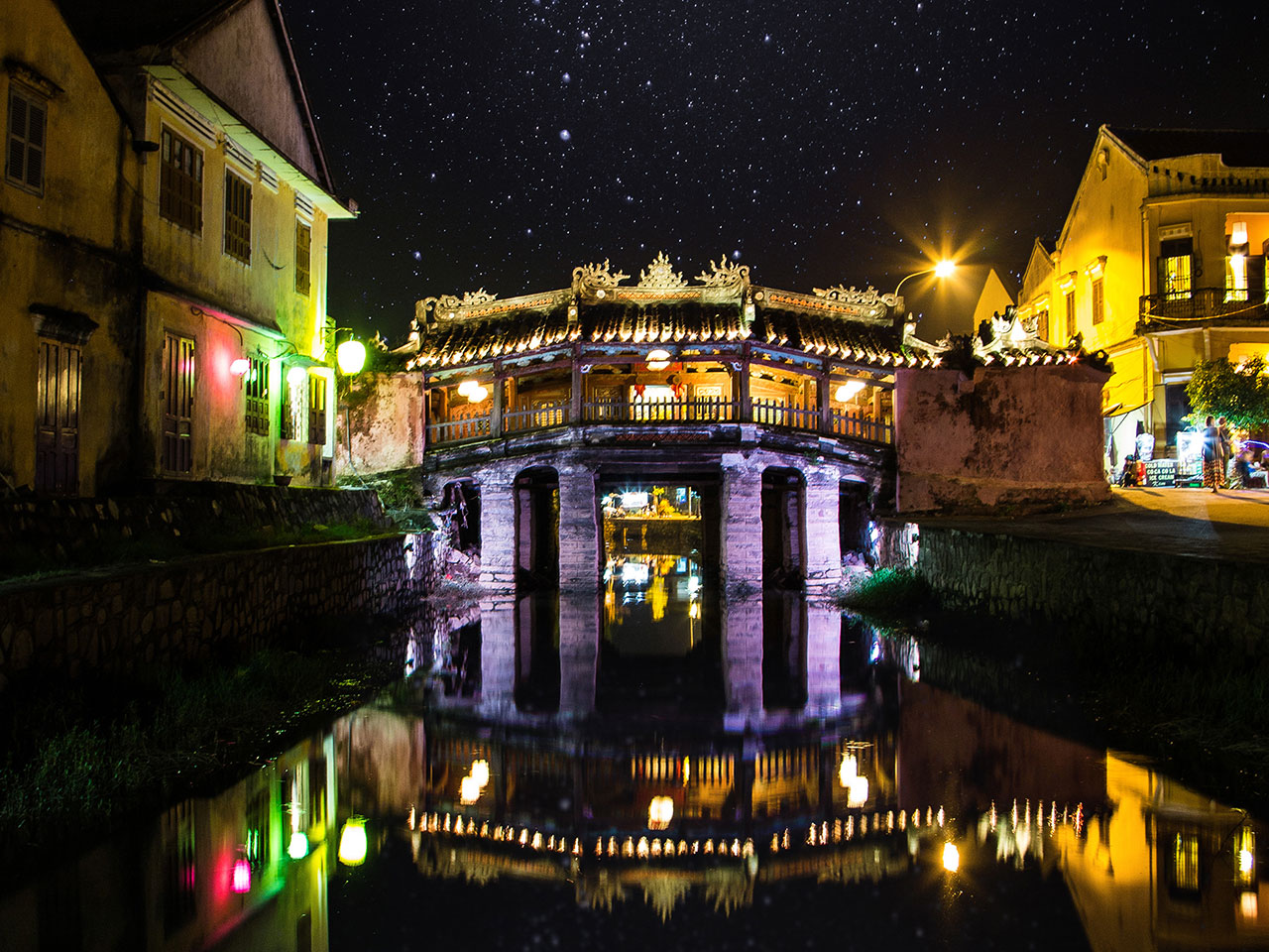 Japanese Covered Bridge illuminated by Hoi An lanterns at night