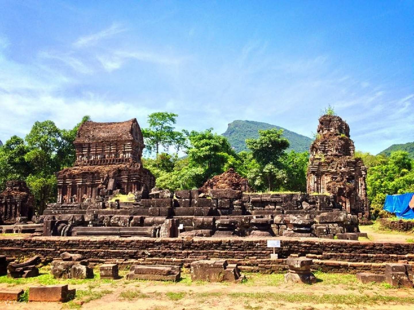 Ancient Cham towers at My Son Sanctuary, a UNESCO World Heritage site near Hoi An, a historical Hoi An day trip activity.