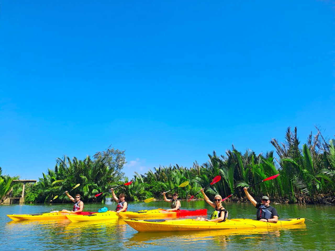 Secret spots Hoi An: Kayaker exploring the quiet waterways of Cam Thanh Coconut Forest.