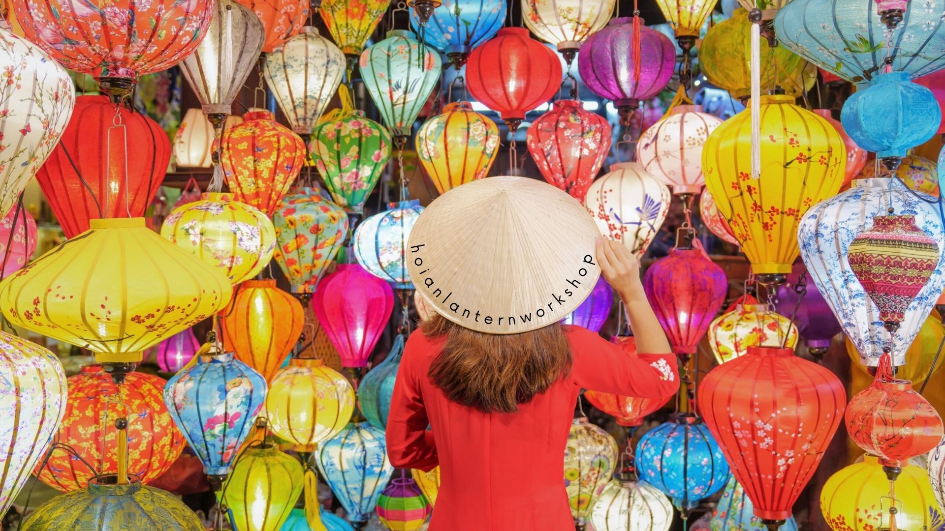 Hands crafting a traditional silk lantern in a Hoi An workshop, a creative and memorable Hoi An activity.