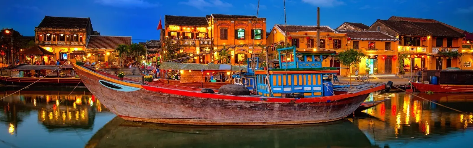 Hoi An Ancient Town at night with glowing lanterns and bustling street life, epitomizing nightlife Hoi An